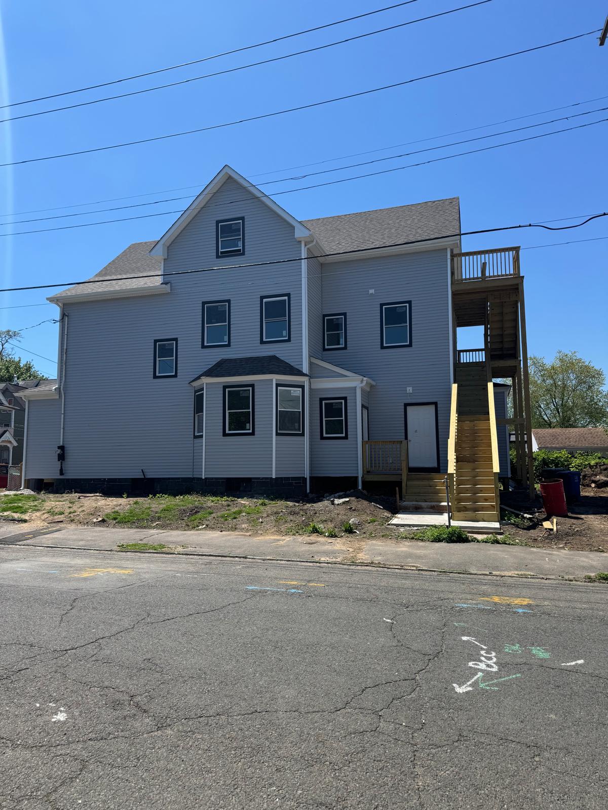 Colonial home exterior after full renovation project by Riverstone Development general contractor in Bridgeport CT